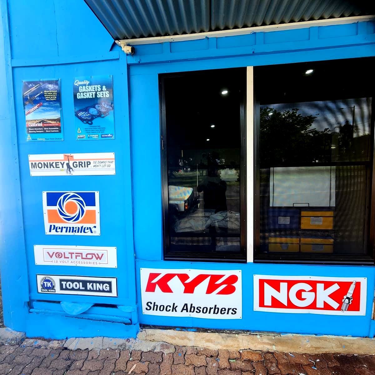 A Blue Building With Multiple Signs — Murgon Auto Parts & Outdoors In Murgon, QLD