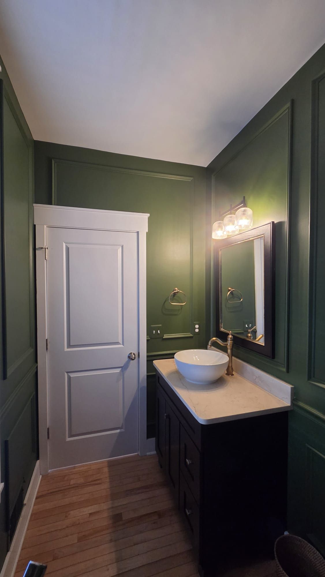 A bathroom with a tub , sink , toilet and shower.