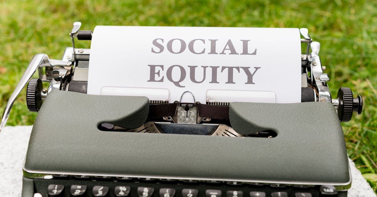 A typewriter with a piece of paper that says social equity on it.