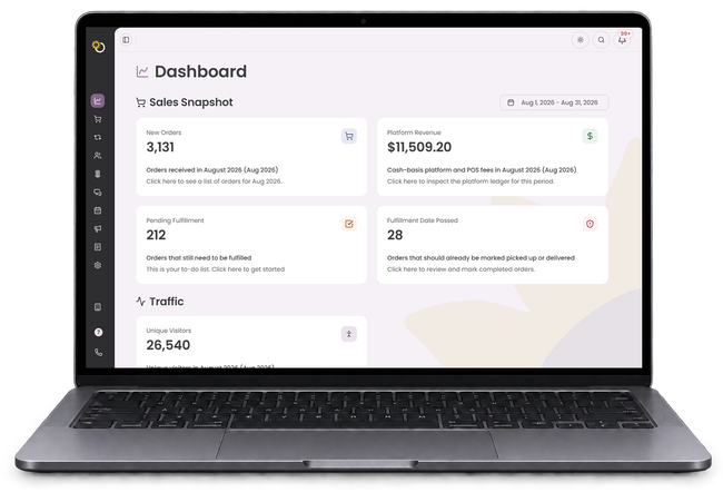Laptop displaying a clean analytics dashboard with stats cards