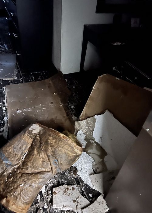 A room with a lot of broken pieces of paper on the floor A room with a lot of broken pieces of paper on the floor
