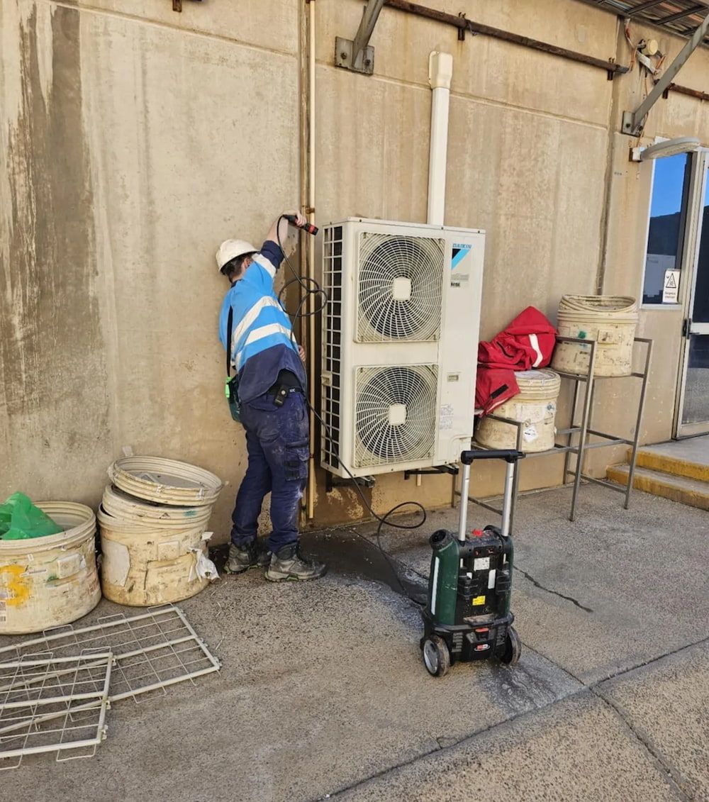 Hvac Technician in Reflective Gear — BNS Refrigeration Services in Healy, QLD