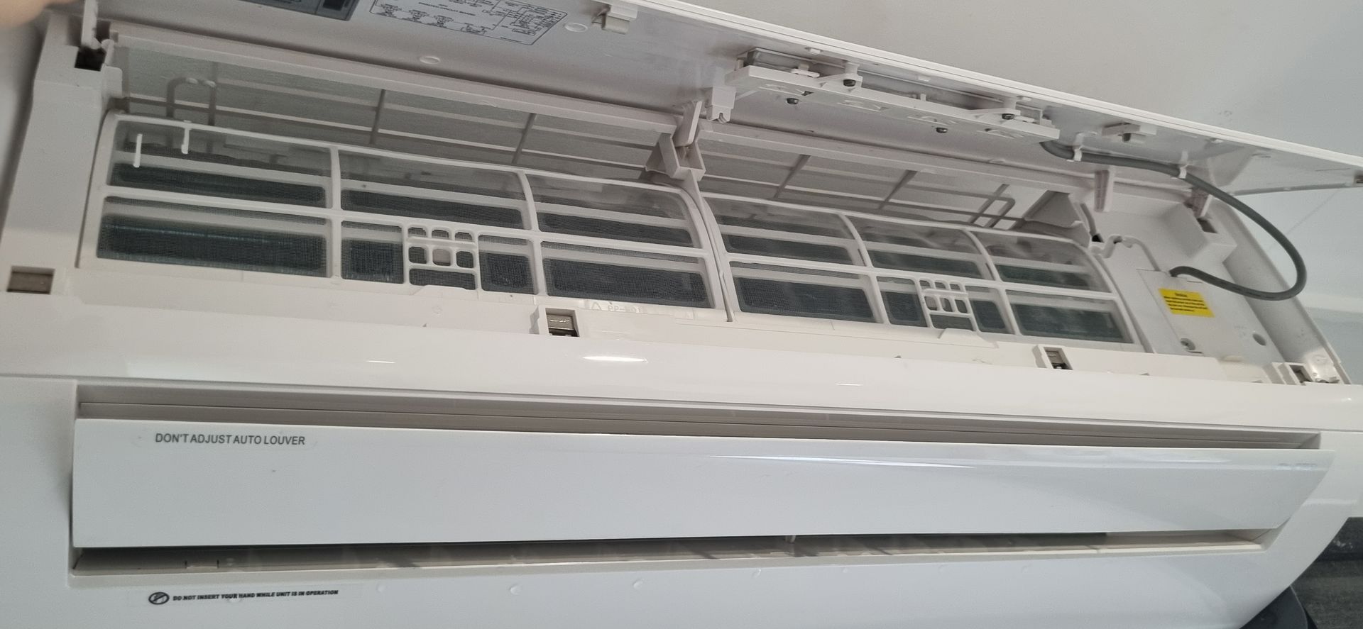 An Open Air Conditioning Unit With Removable Filter Screens — BNS Refrigeration Services in Healy, QLD