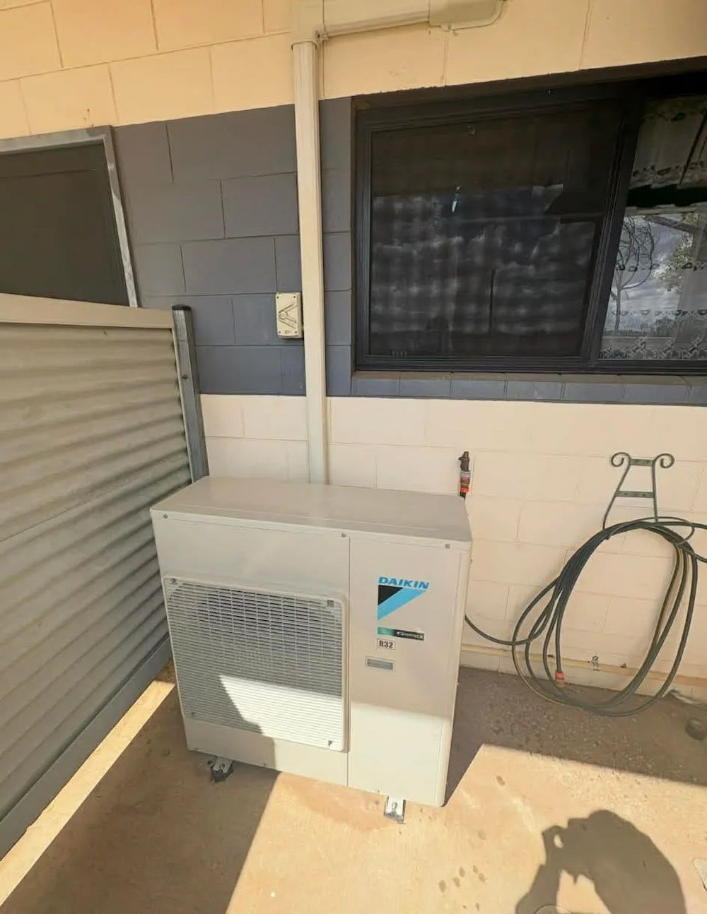 Silver Daikin Air Conditioner Unit Outside — BNS Refrigeration Services in Healy, QLD