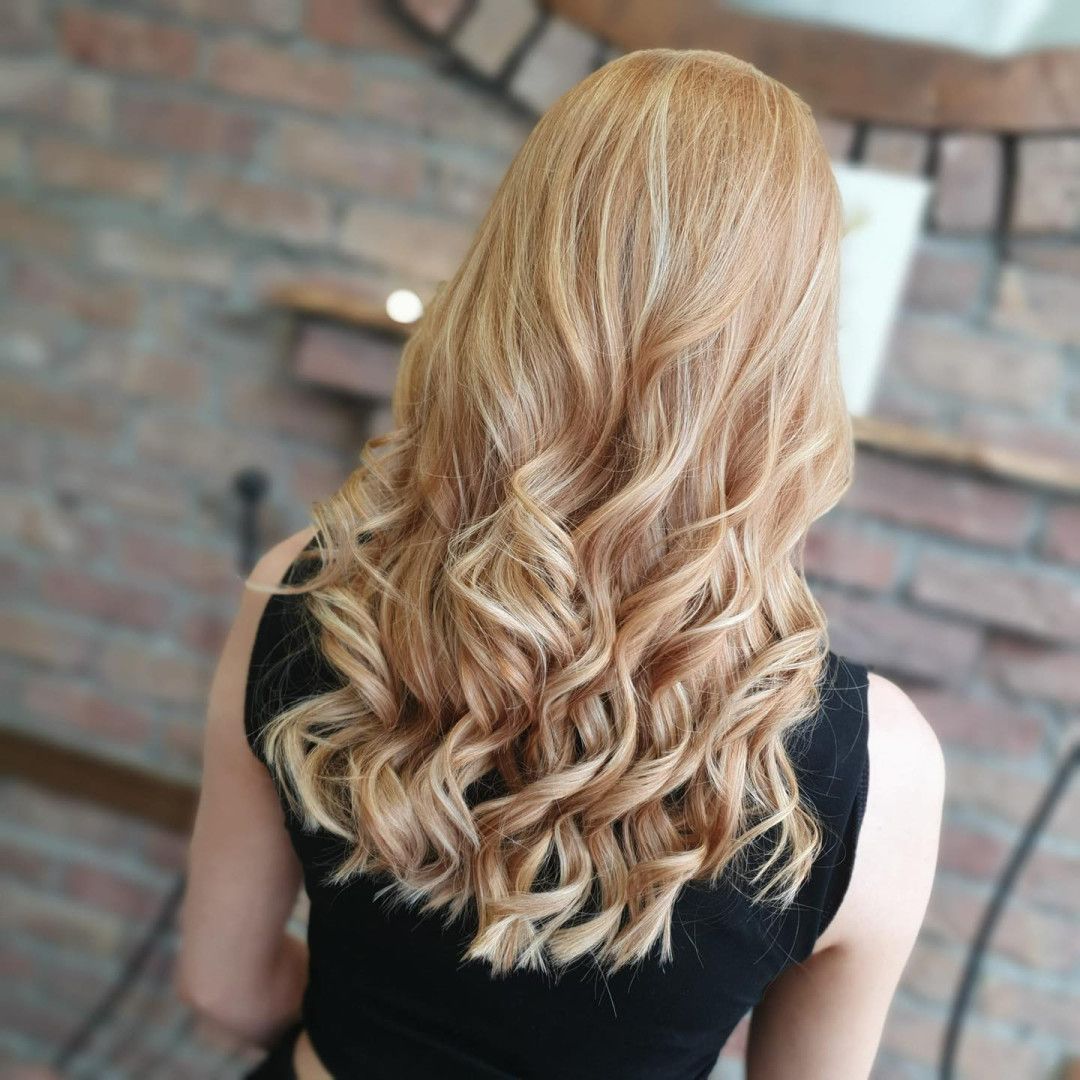 A Woman is Getting Her Hair Dyed in a Salon