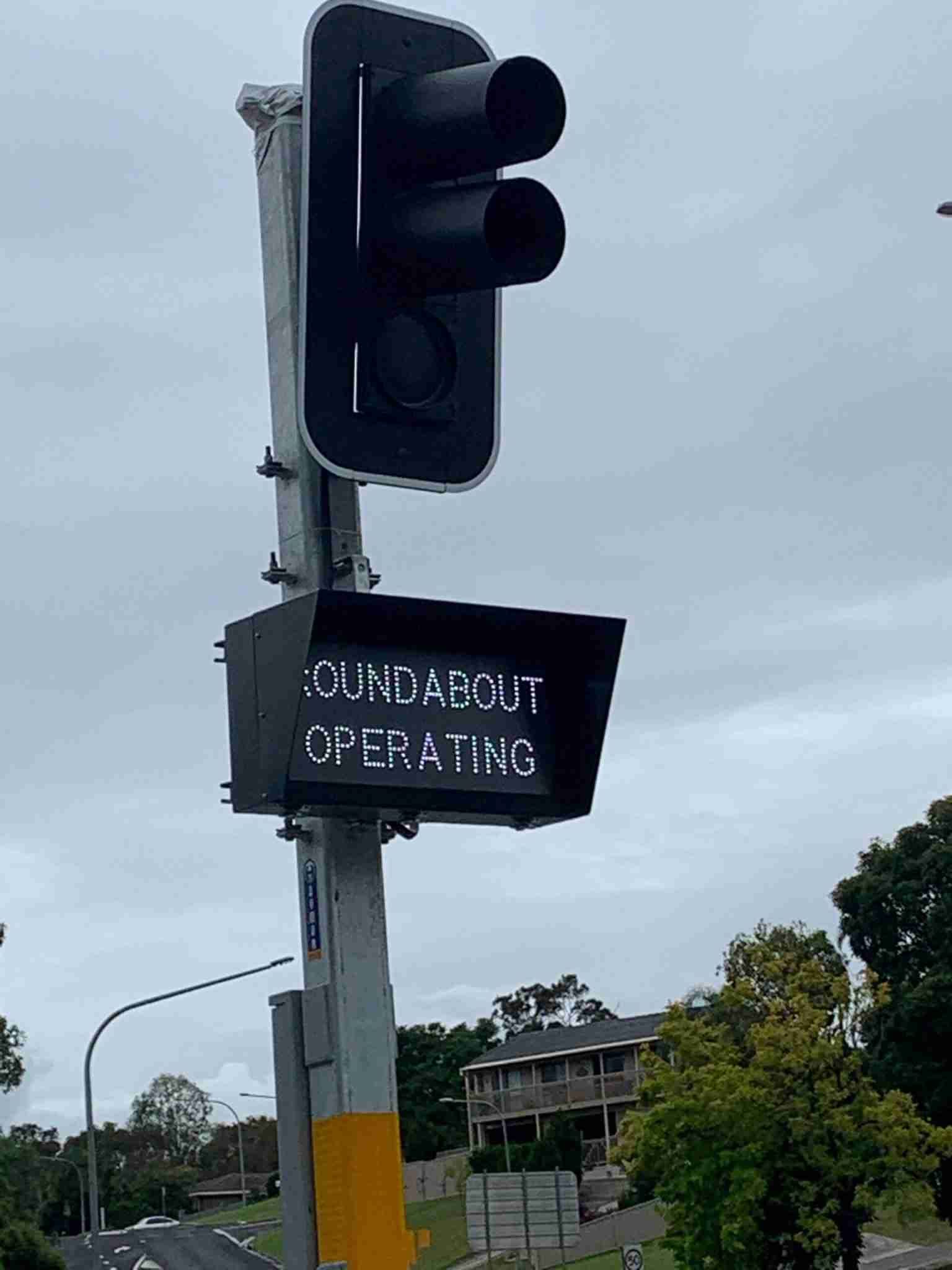 A Traffic Light with A Sign that Says ' Roundabout Operating ' on It — Bay Coast Electrical & Control Solutions in Maloneys Beach, NSW