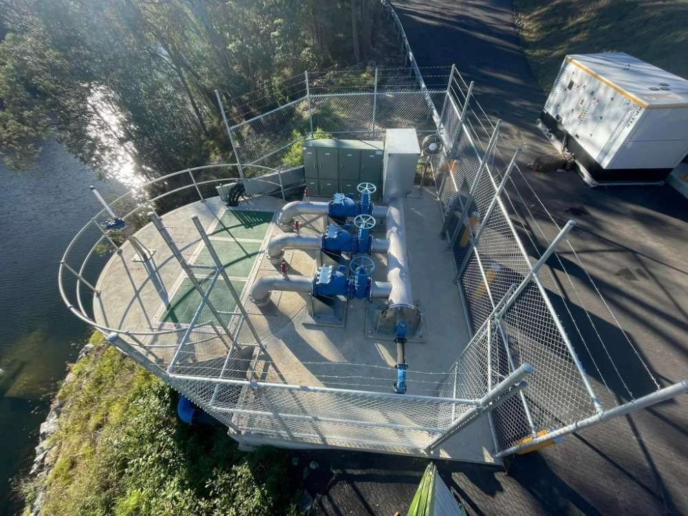 An Aerial View Of A Fenced In Area Next To A River — BayCoast Electrical & Control Solutions in Ulladulla, NSW