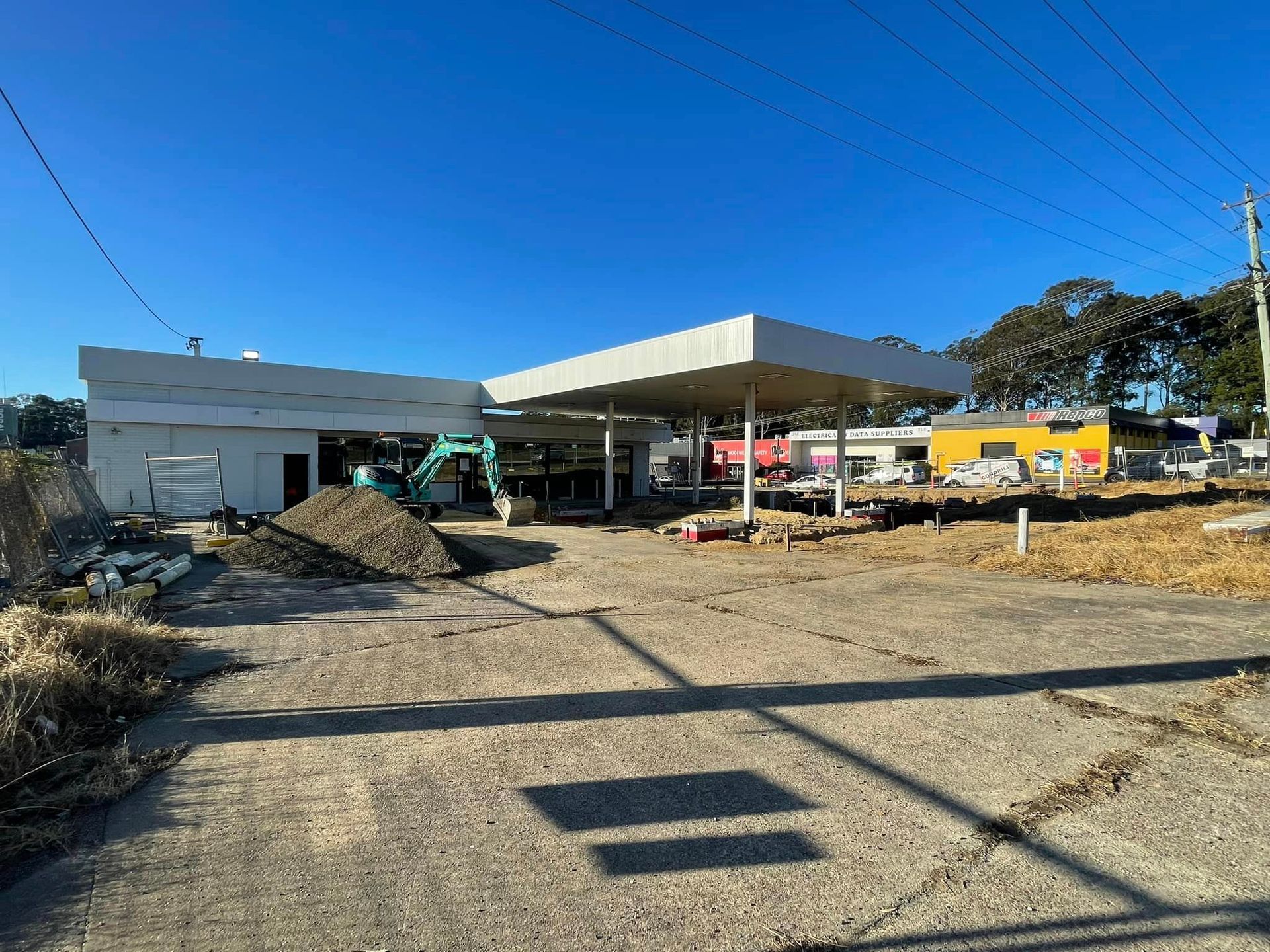 A Large Room With A Wooden Floor And Lots Of Shelves — BayCoast Electrical & Control Solutions in Maloneys Beach, NSW