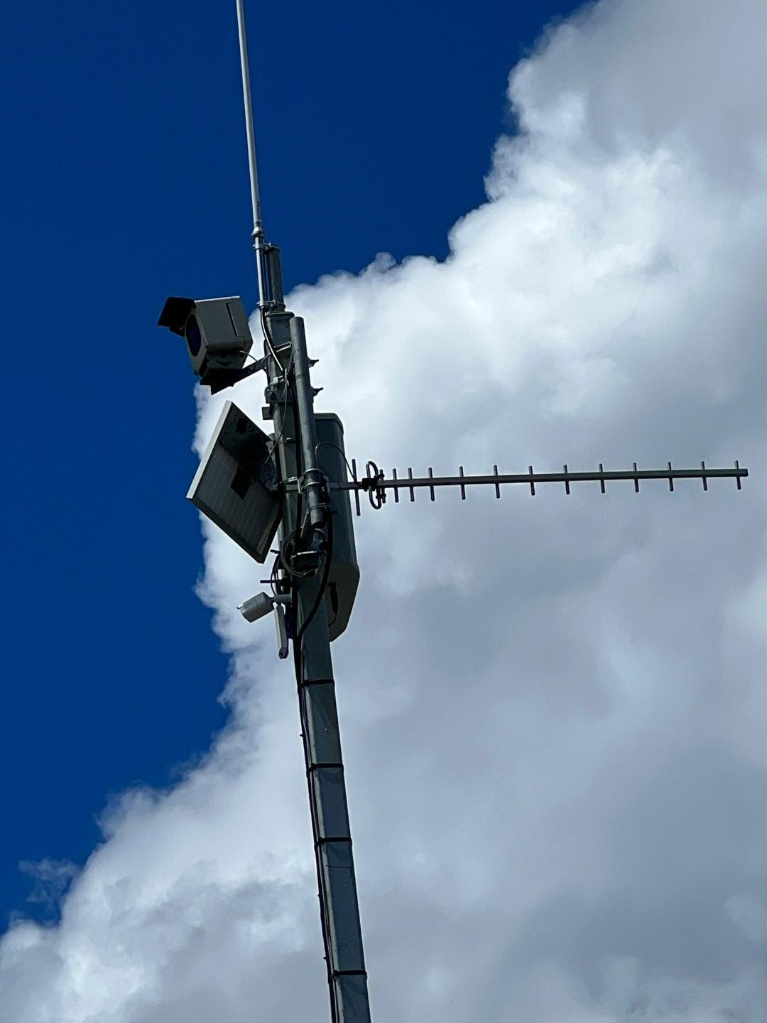 A Very Tall Antenna With A Blue Sky In The Background — BayCoast Electrical & Control Solutions in Maloneys Beach, NSW