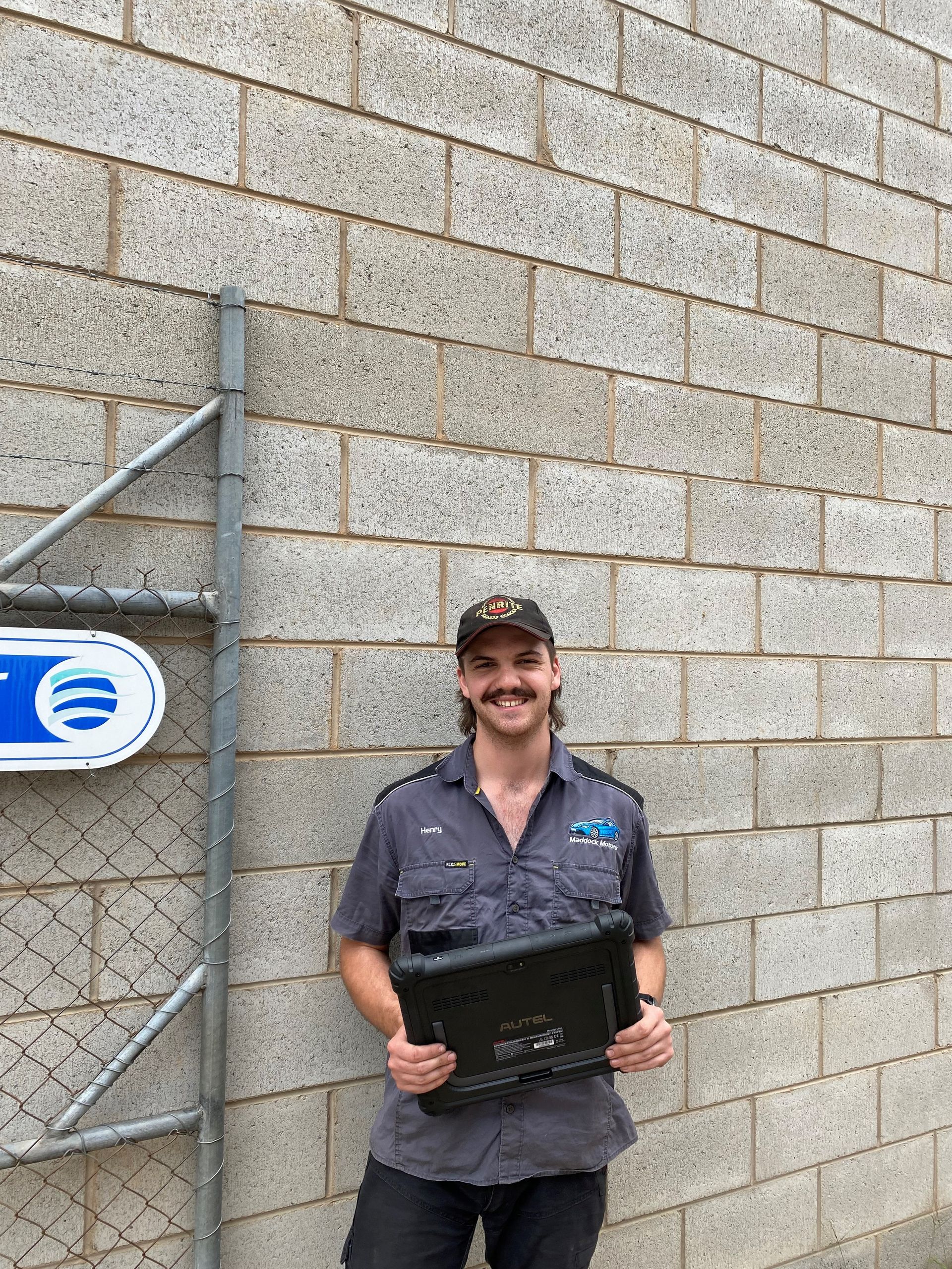 A Person With a Mustache and Cap Wears a Grey Shirt — Maddock Motors-Wodonga Auto Air In Wodonga, VIC