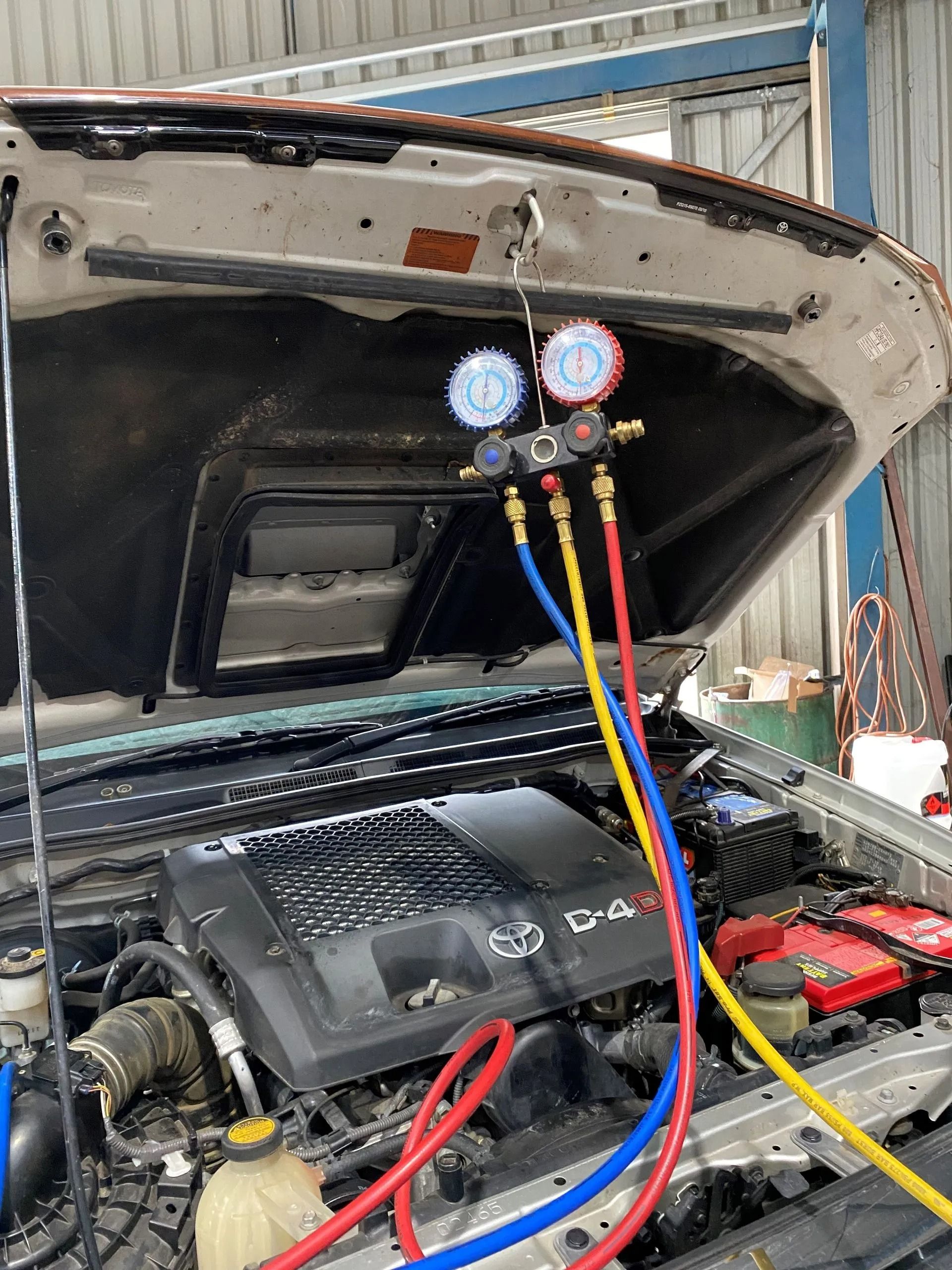 AC Manifold Gauge Set Connected to the Engine of a Car — Maddock Motors-Wodonga Auto Air In Wodonga, VIC
