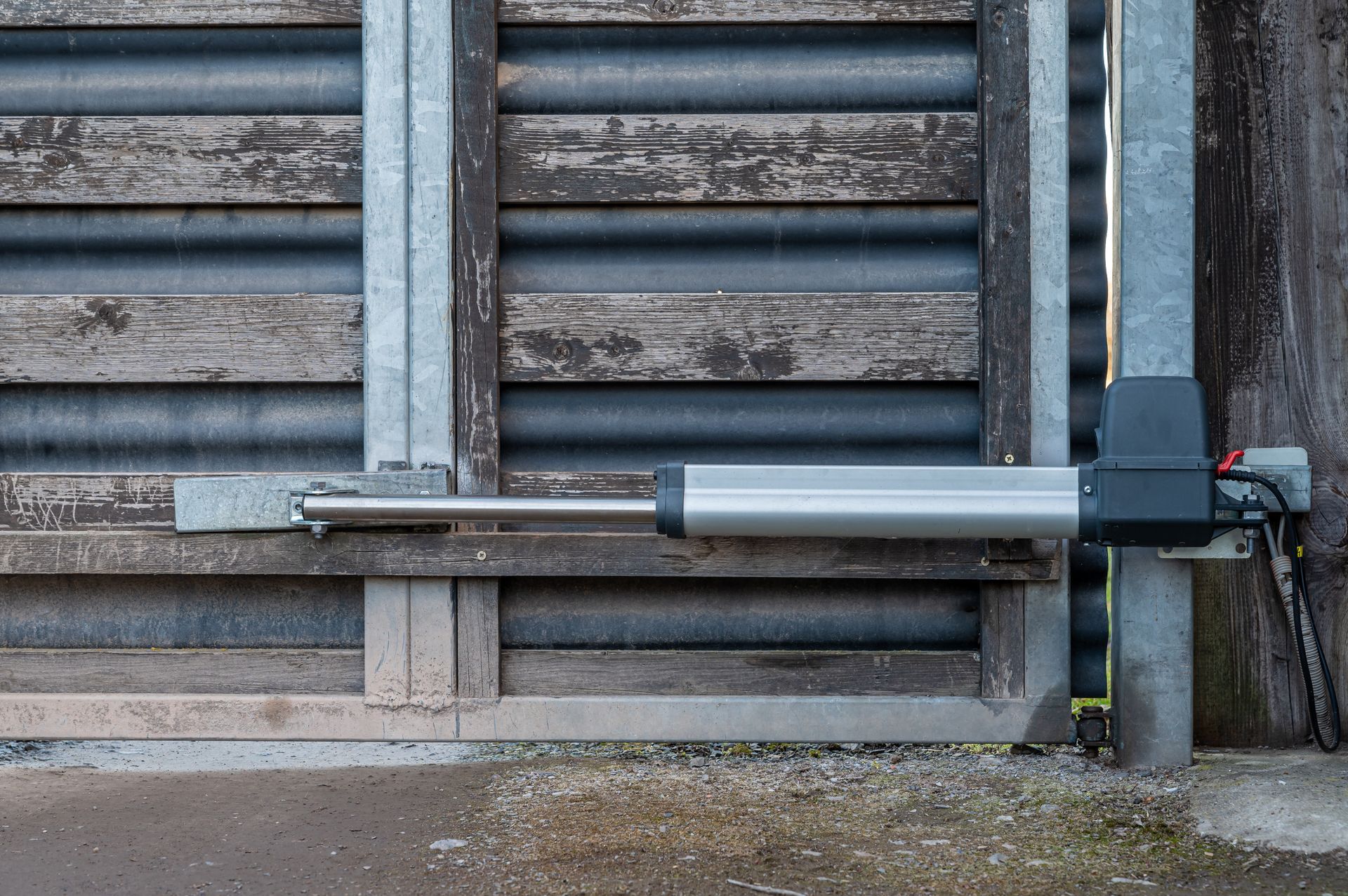A close up of a gate with a motor attached to it.
