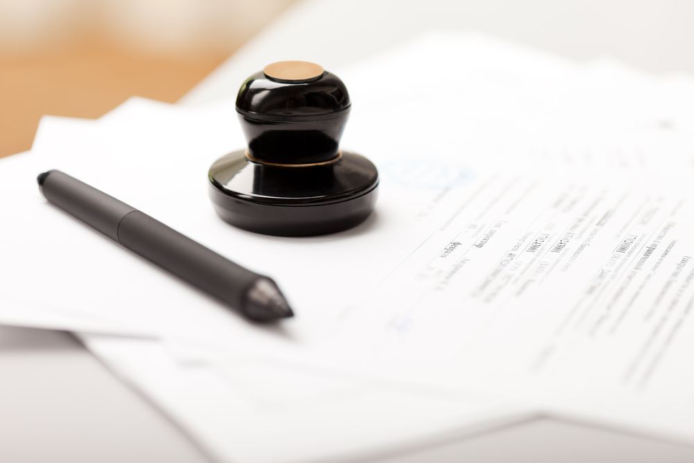 Legal document with pen and stamp