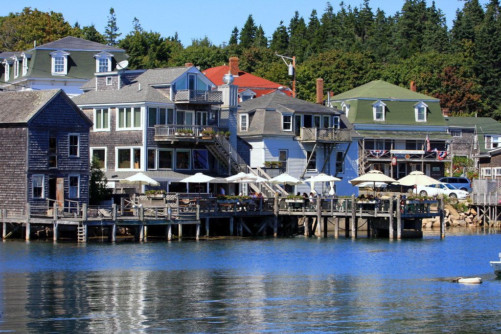 A row of houses on stilts next to a body of water