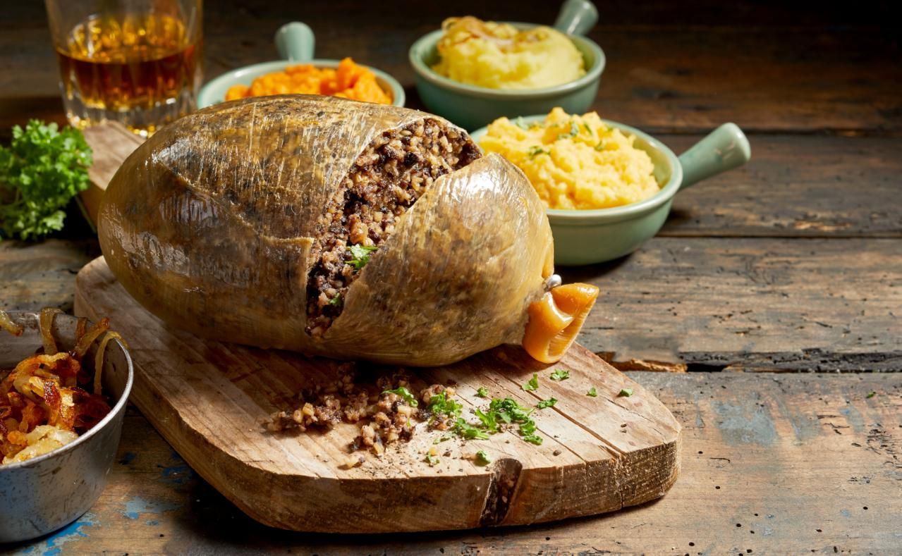 A Large Piece Of Food Is Sitting On Top Of A Wooden Cutting Board — Edgeworth Meat & More in Edgeworth, NSW