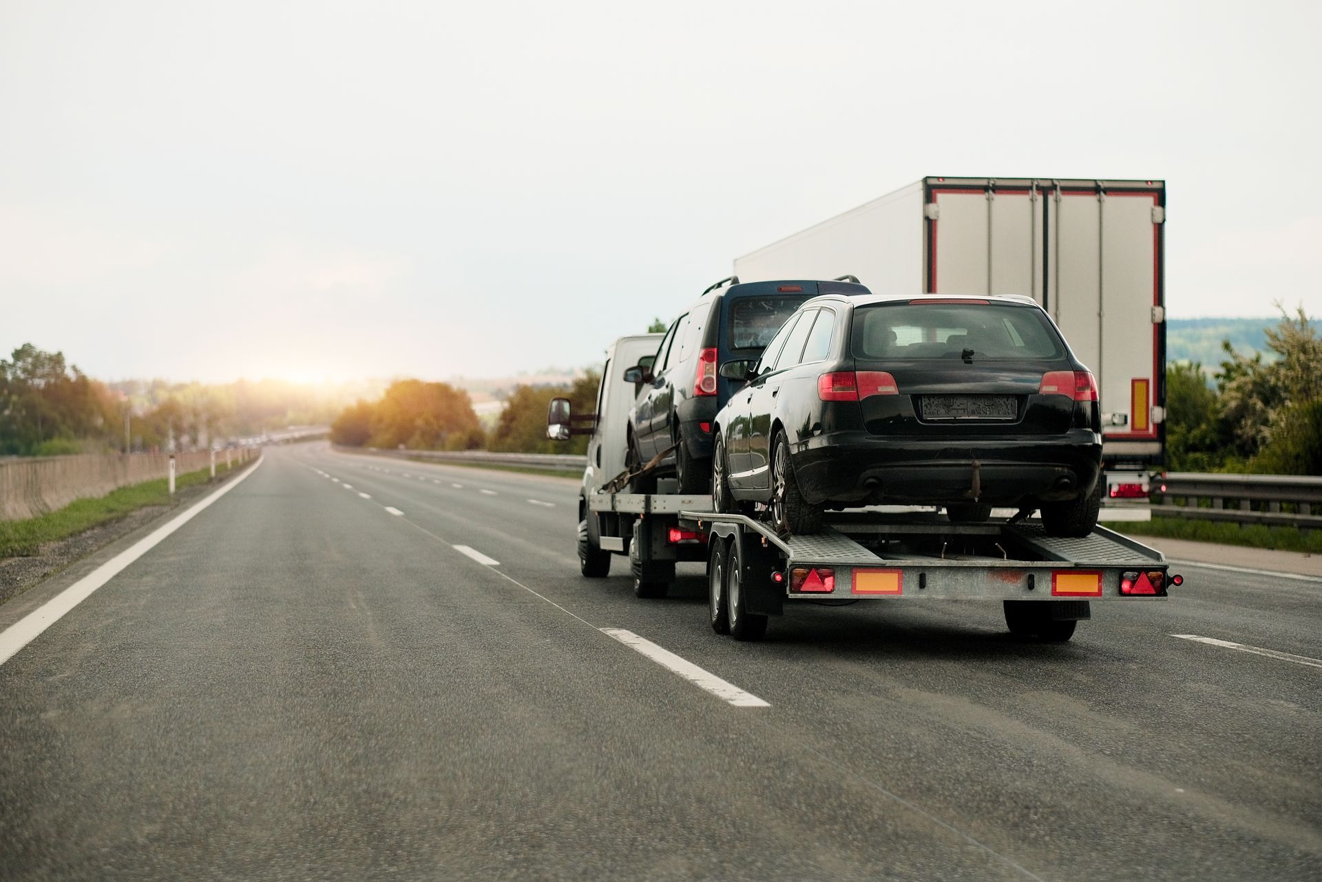 A car is being towed. A car is being towed.