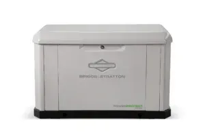 White Briggs & Stratton standby generator in a housing. White Briggs & Stratton standby generator in a housing.