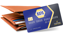 A blue NAPA branded credit card by Synchrony Car Care positioned in front of an open brown leather wallet.