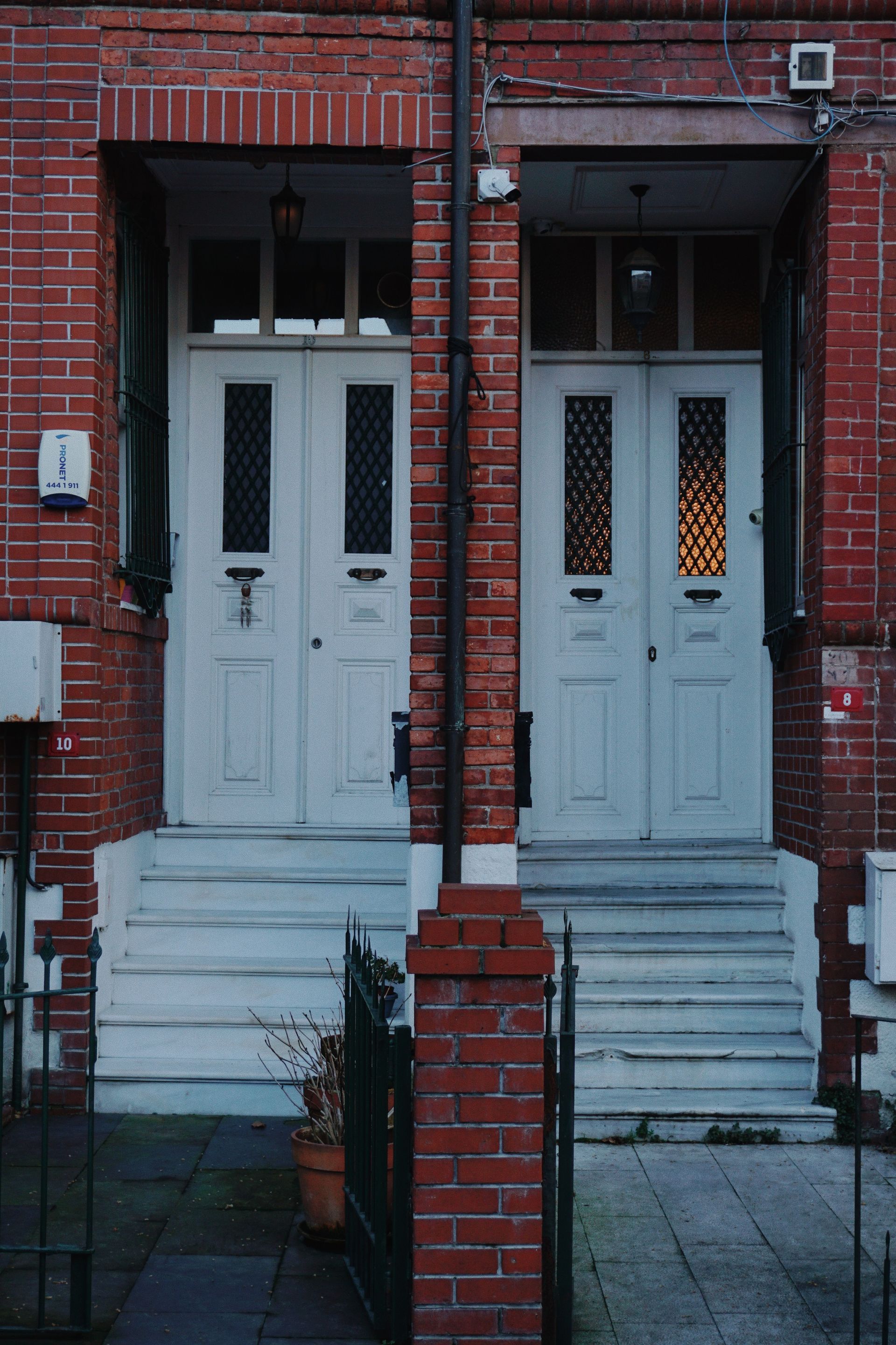 Brick duplex rental property with two separate front entrances on a quiet North Texas residential street