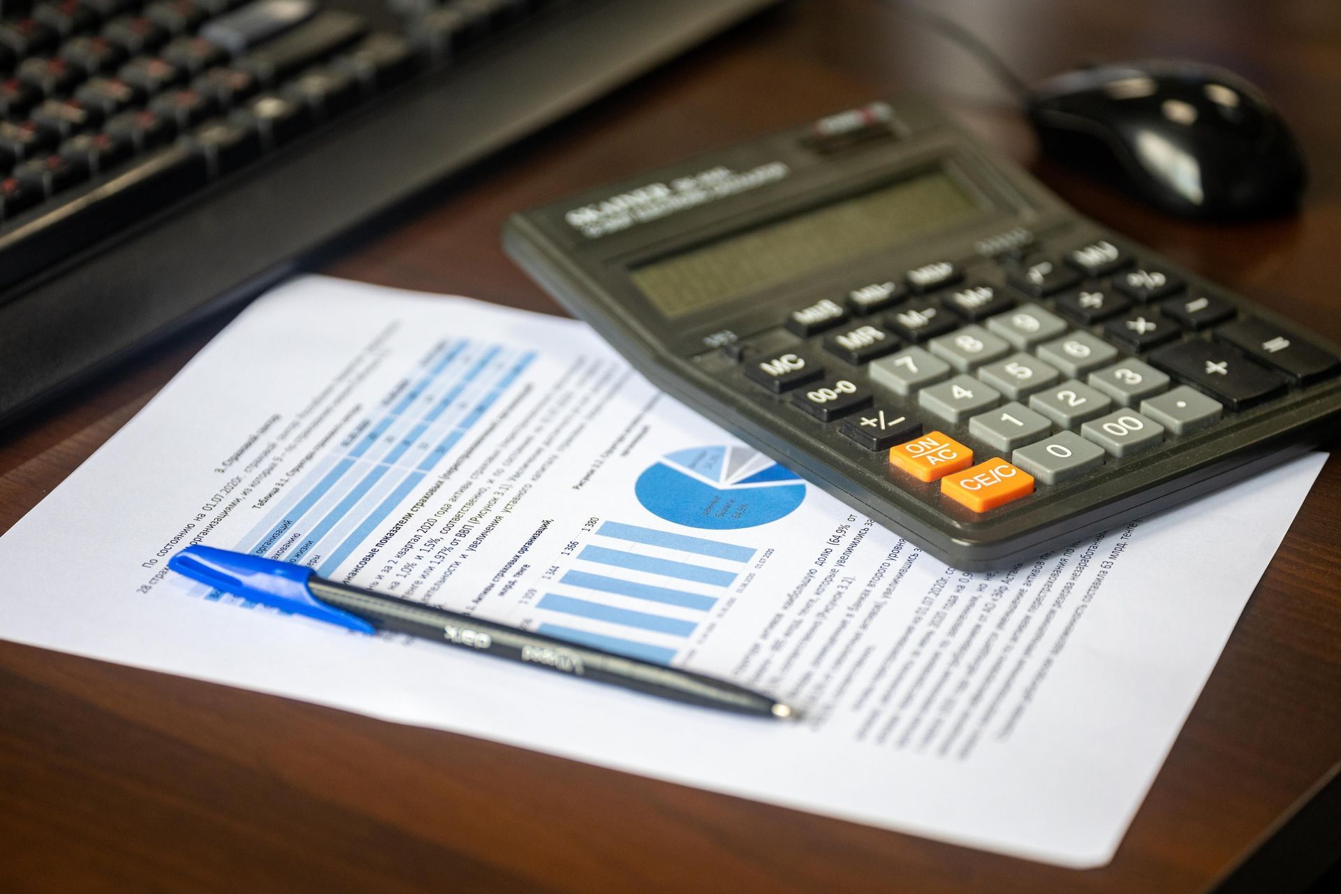 Pay stub and calculator side by side, the math that reveals the gap in a 60% group disability benefit
