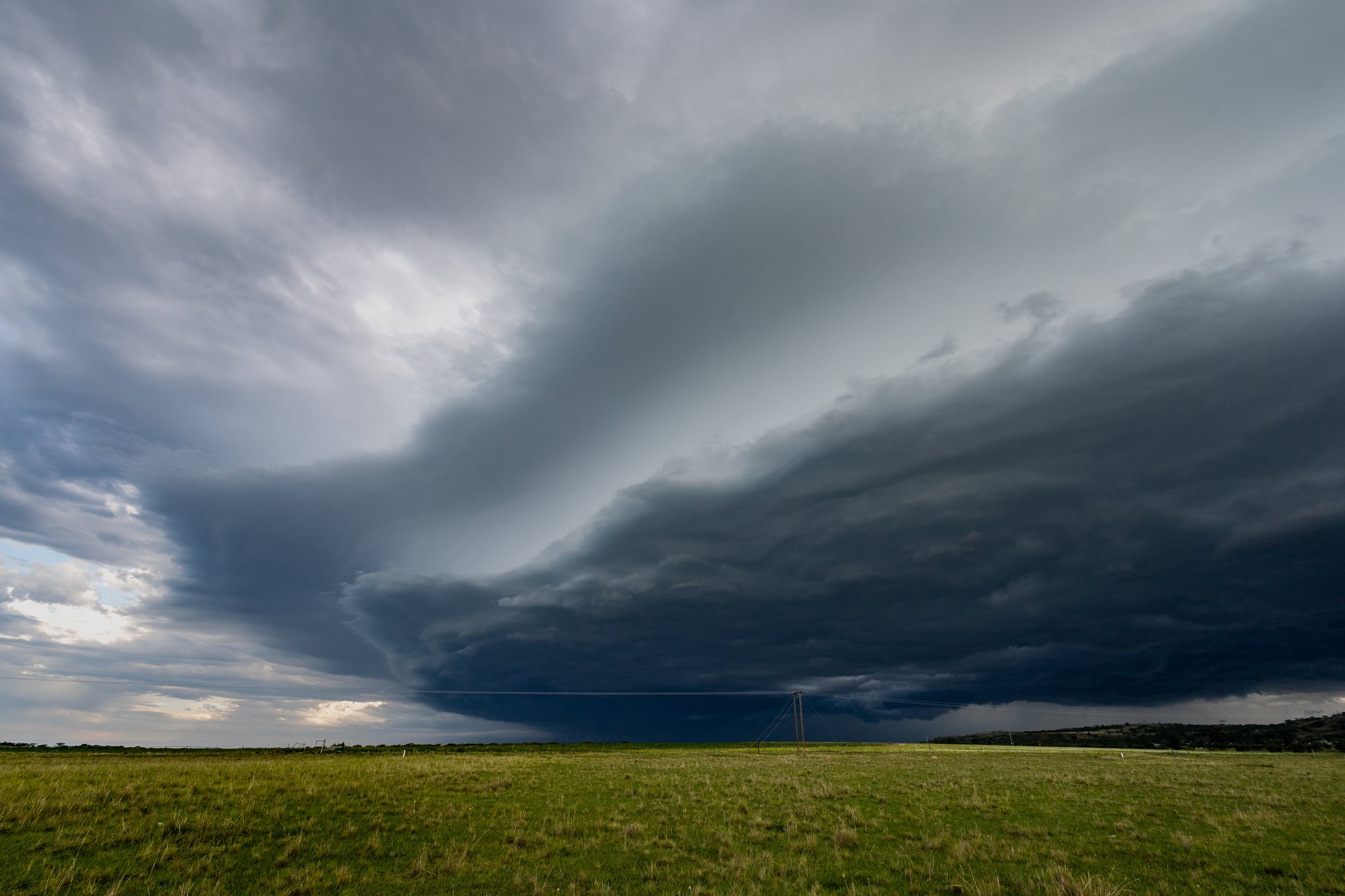 A storm front rolling over flat North Texas farmland, the kind of hail system that pushes homeowners onto the FAIR Plan.