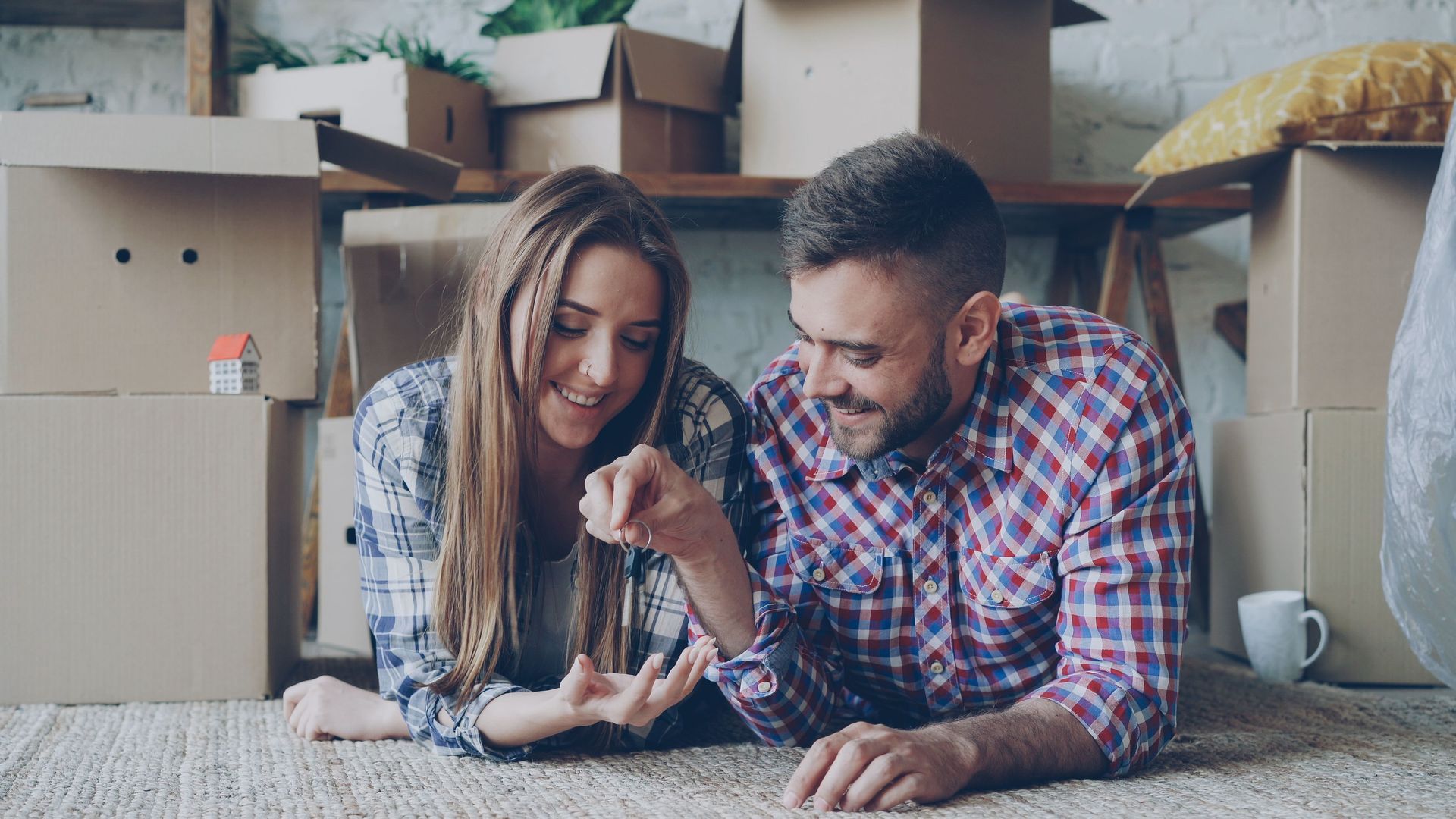 New Texas residents unpack moving boxes and plan home and auto insurance for their new Wise County house