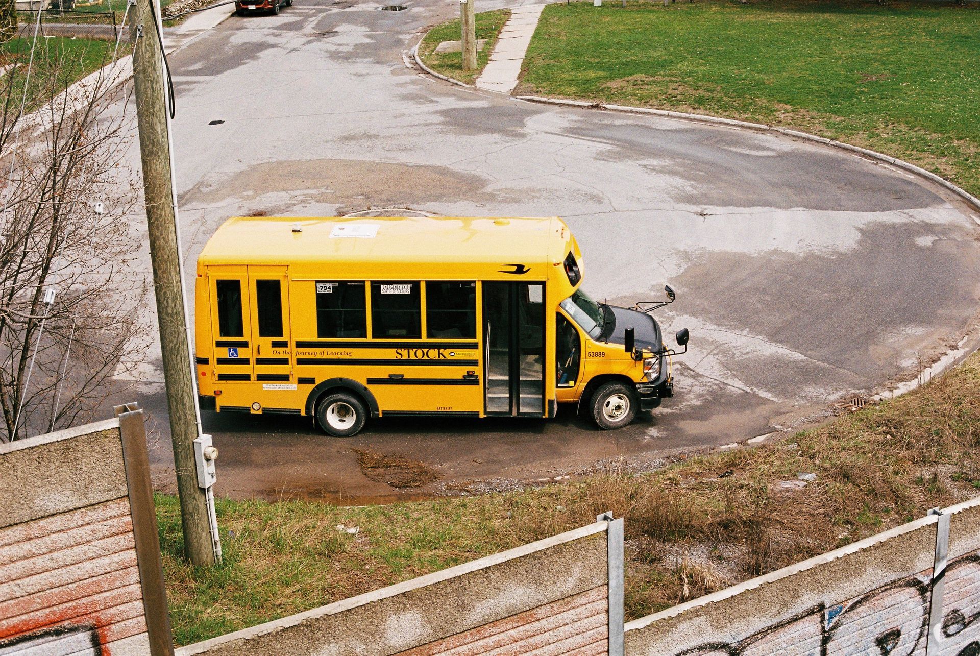 Yellow school bus parked on a suburban street at the start of the school year in Texas