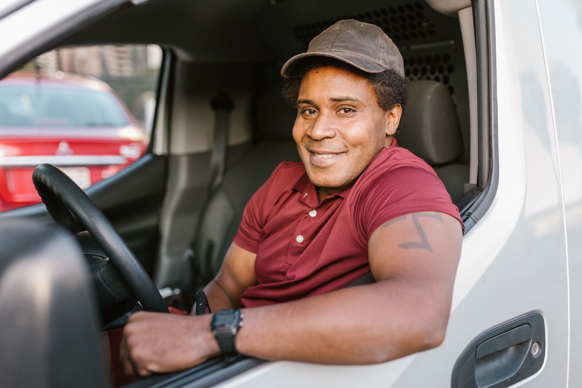 Rideshare and delivery driver behind the wheel in Dallas-Fort Worth, Texas, needing proper auto insurance
