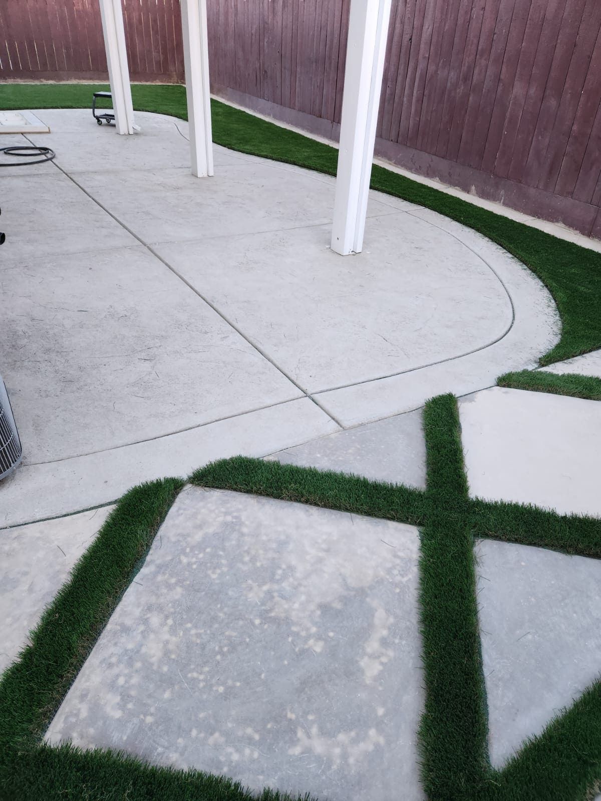 Concrete patio and turf design for Stockton landscape.
