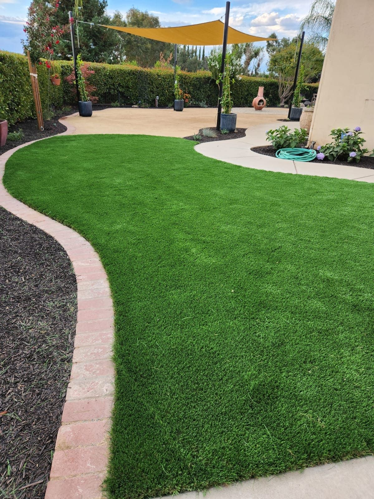 Artificial turf backyard landscaping installation in Stockton CA