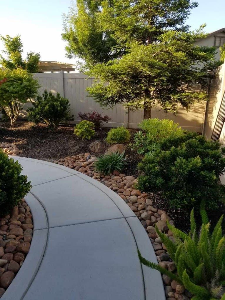 Full-service landscaping project in Stockton CA featuring patio, turf, plants, and outdoor living