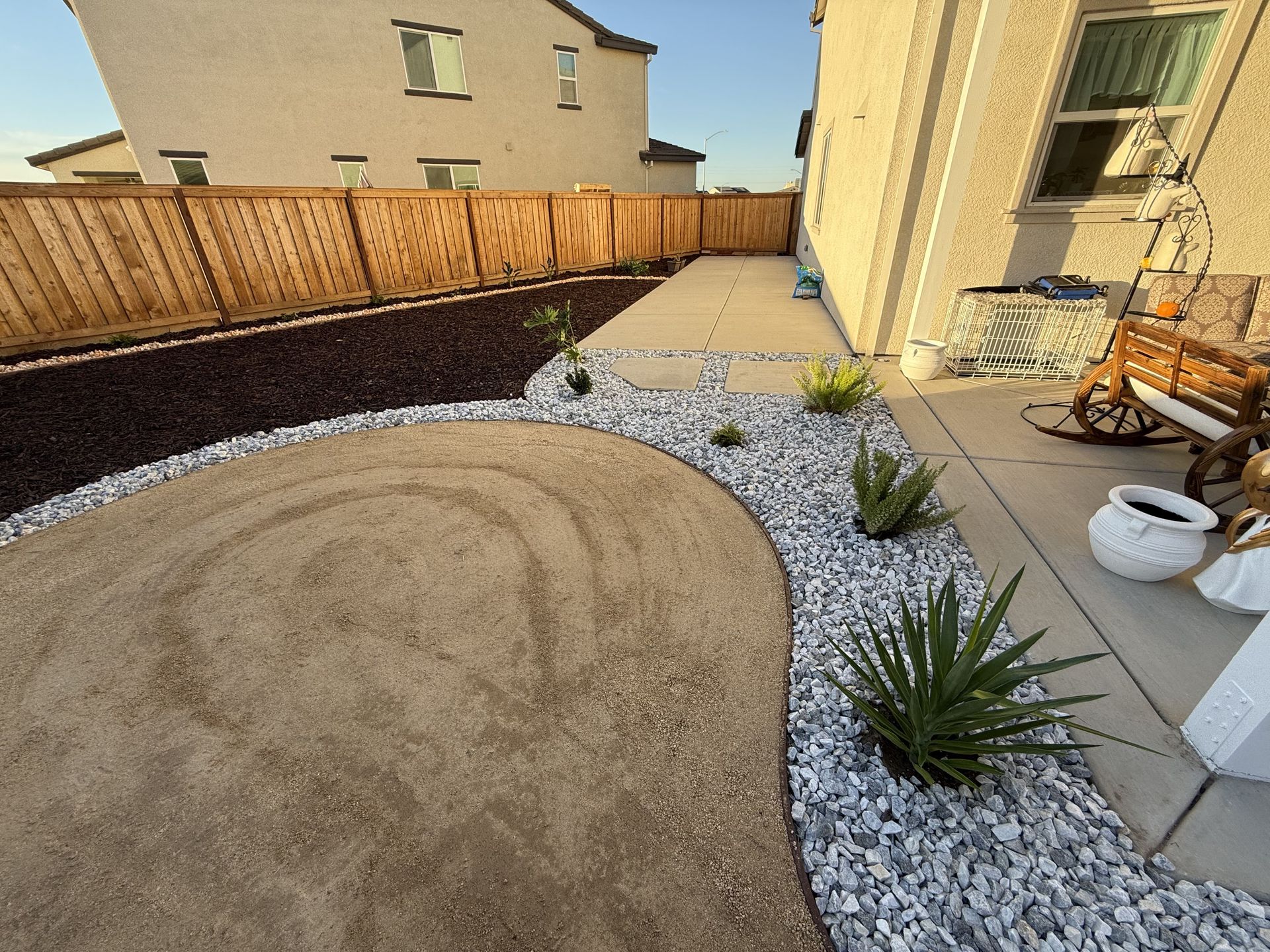 Rock mulch and decorative ground cover installed in a landscaping project in Lodi, CA
