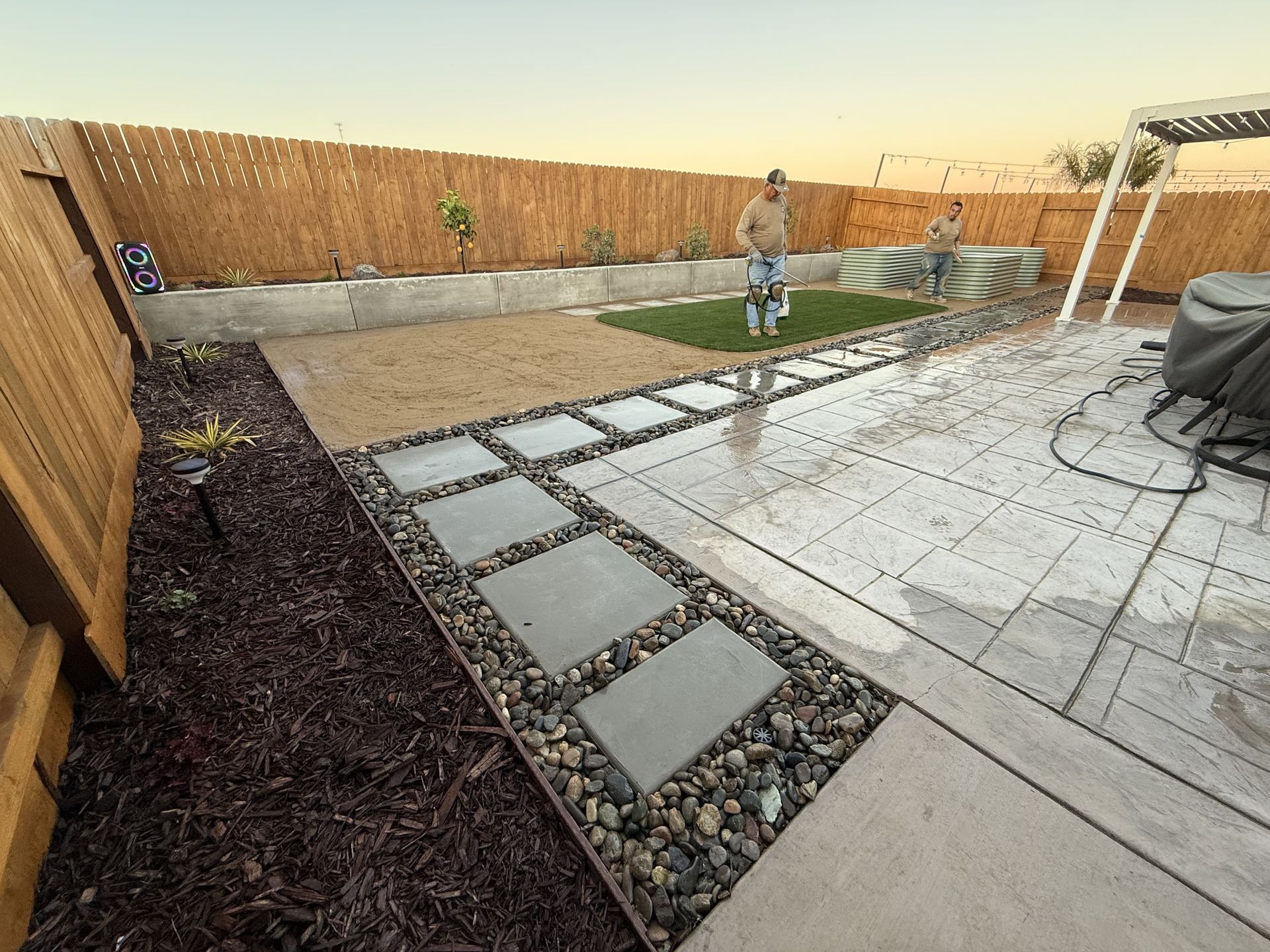 Rock and mulch decorative ground cover on a landscaped patio in Tracy, CA
