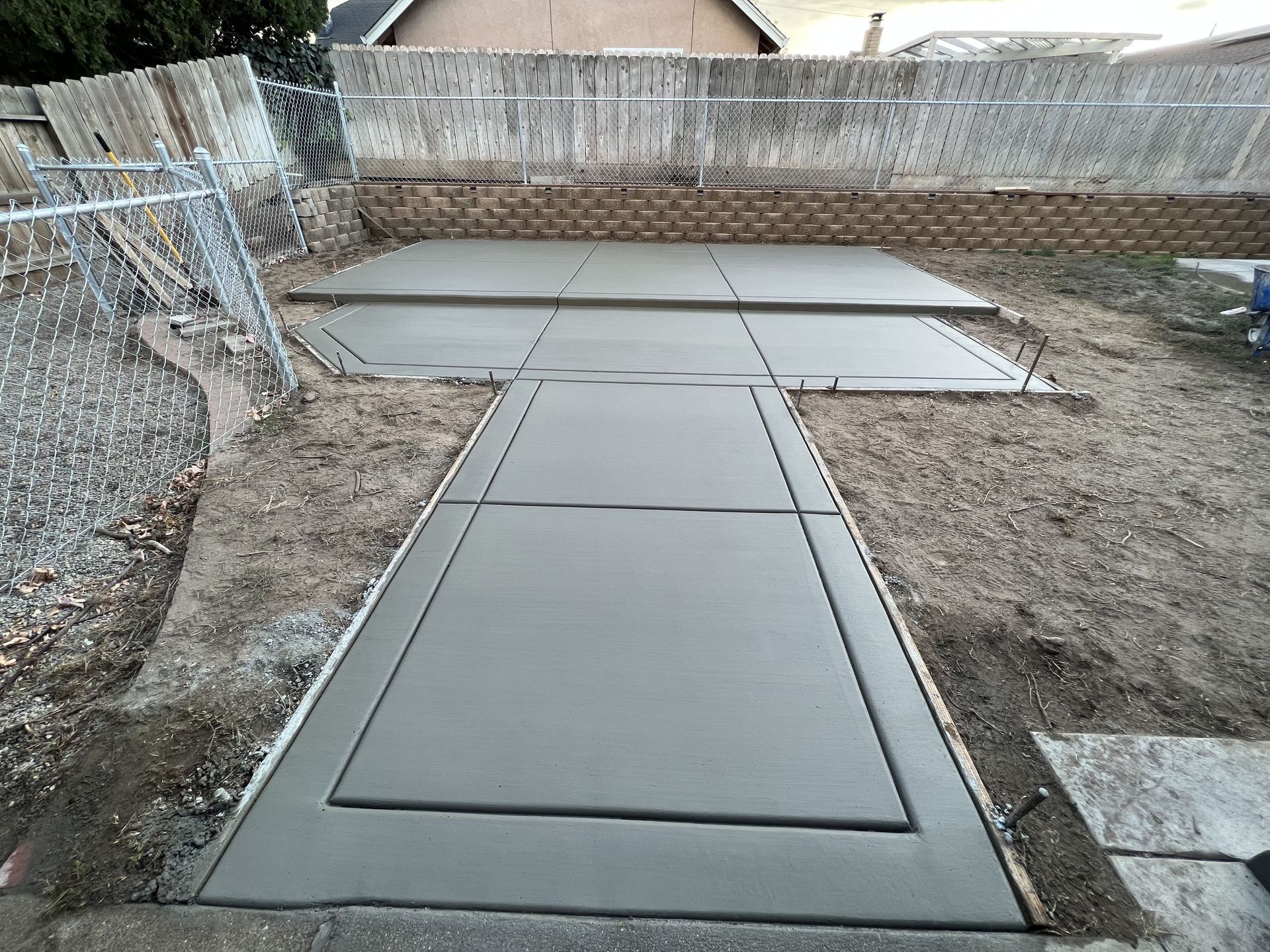 Stamped concrete patio installation in a modern Central Valley backyard makeover