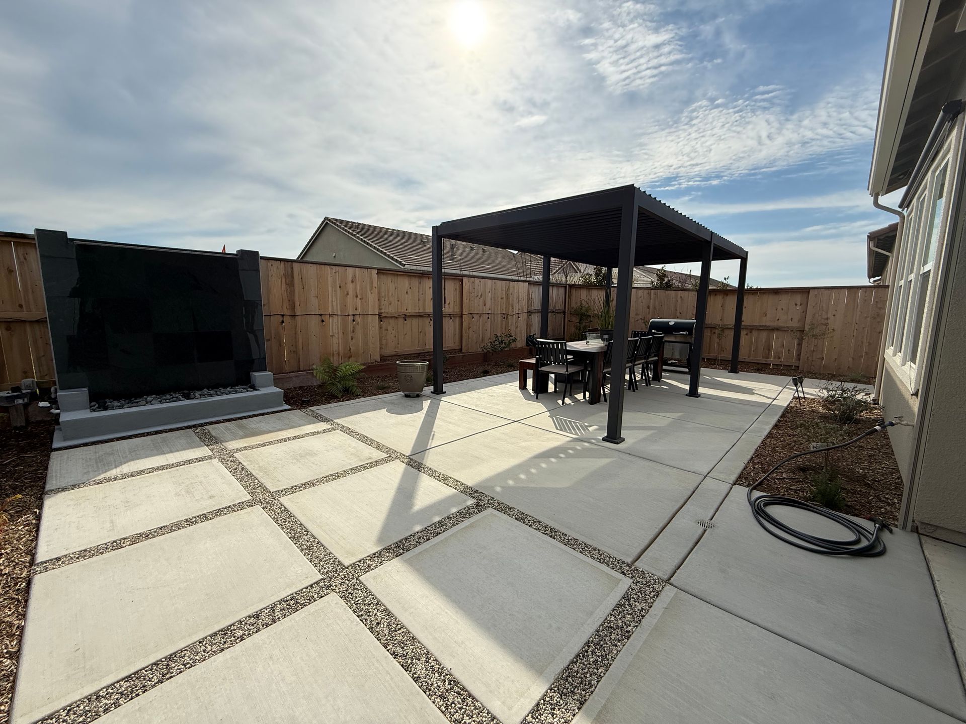 Concrete patio with shade structure installation in Stockton.