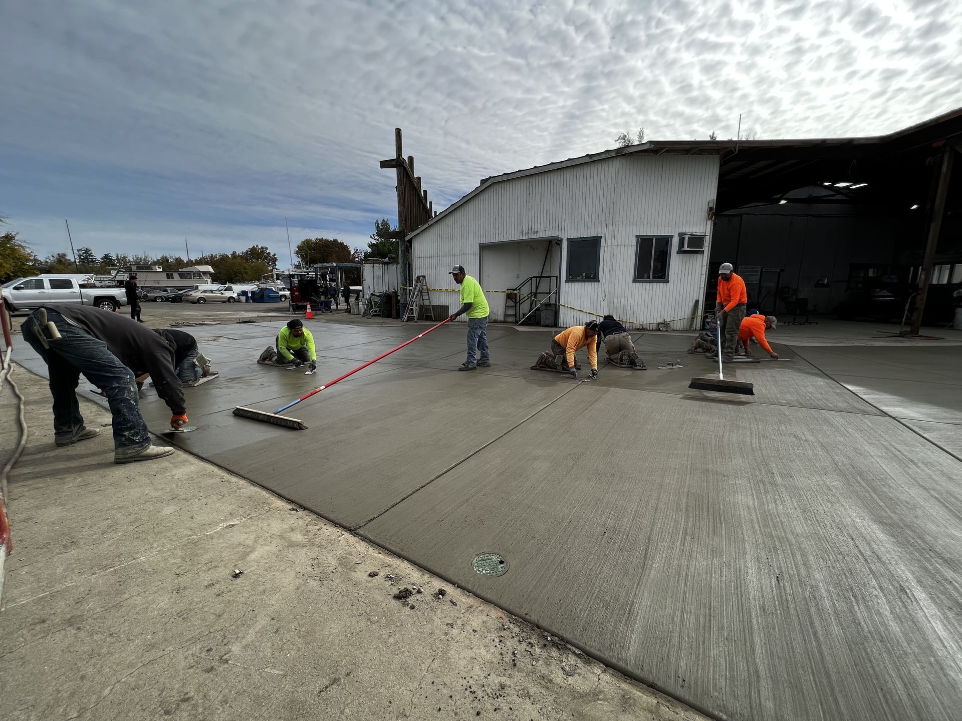 Concrete contractors working on a commercial concrete driveway project in Stockton, California