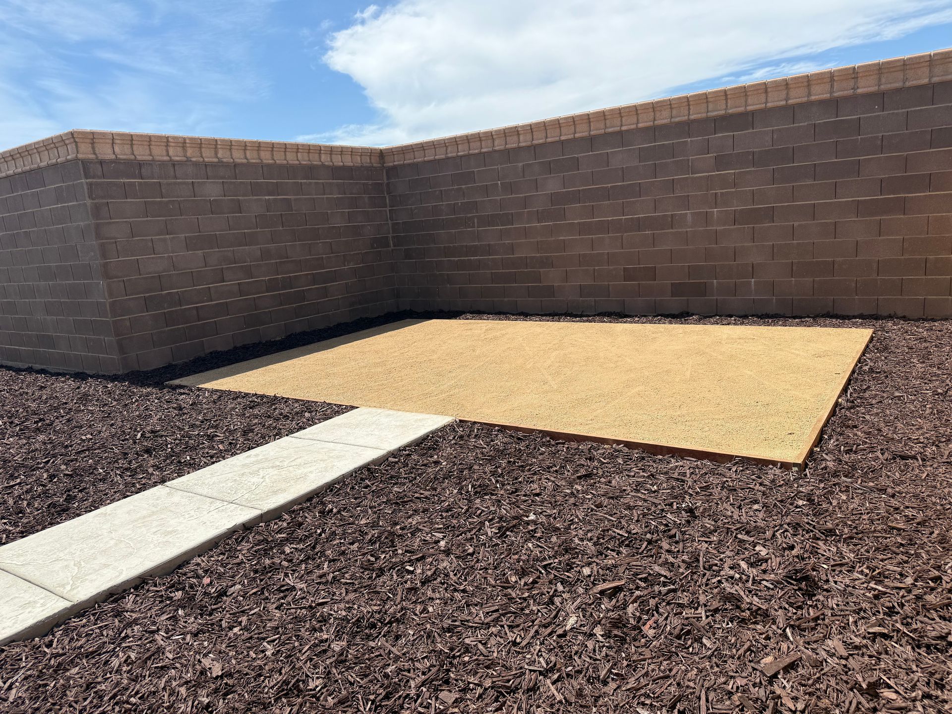 Decorative mulch ground cover installed on a patio in Modesto, CA