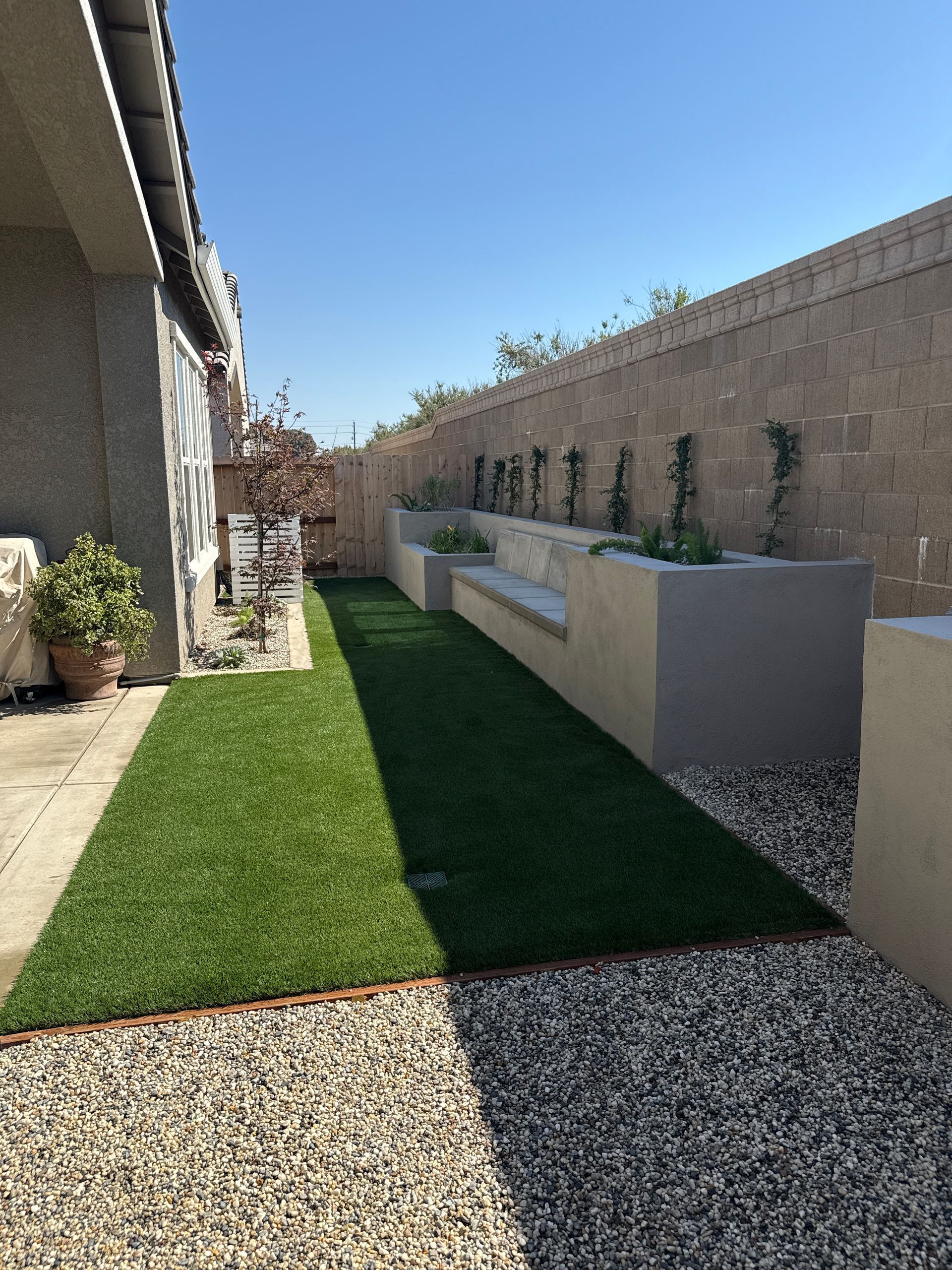 Artificial turf integrated into a backyard landscape design in Stockton