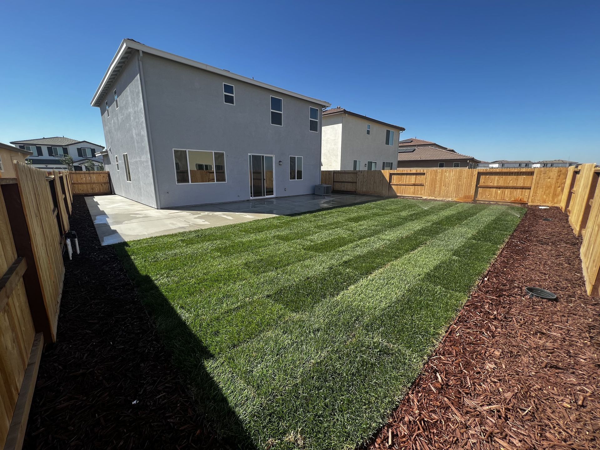 Fresh turf installed as part of Stockton landscaping project.