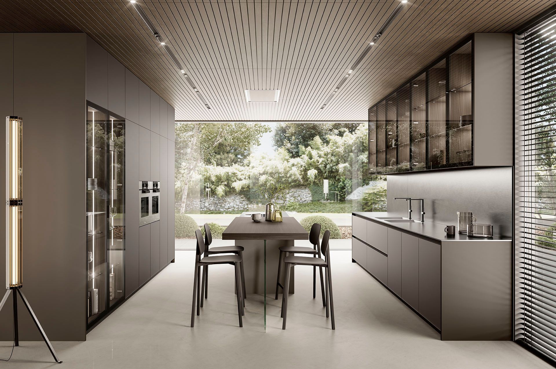 Cucina moderna e minimalista con zona pranzo e ampia finestra che si affaccia sul verde.