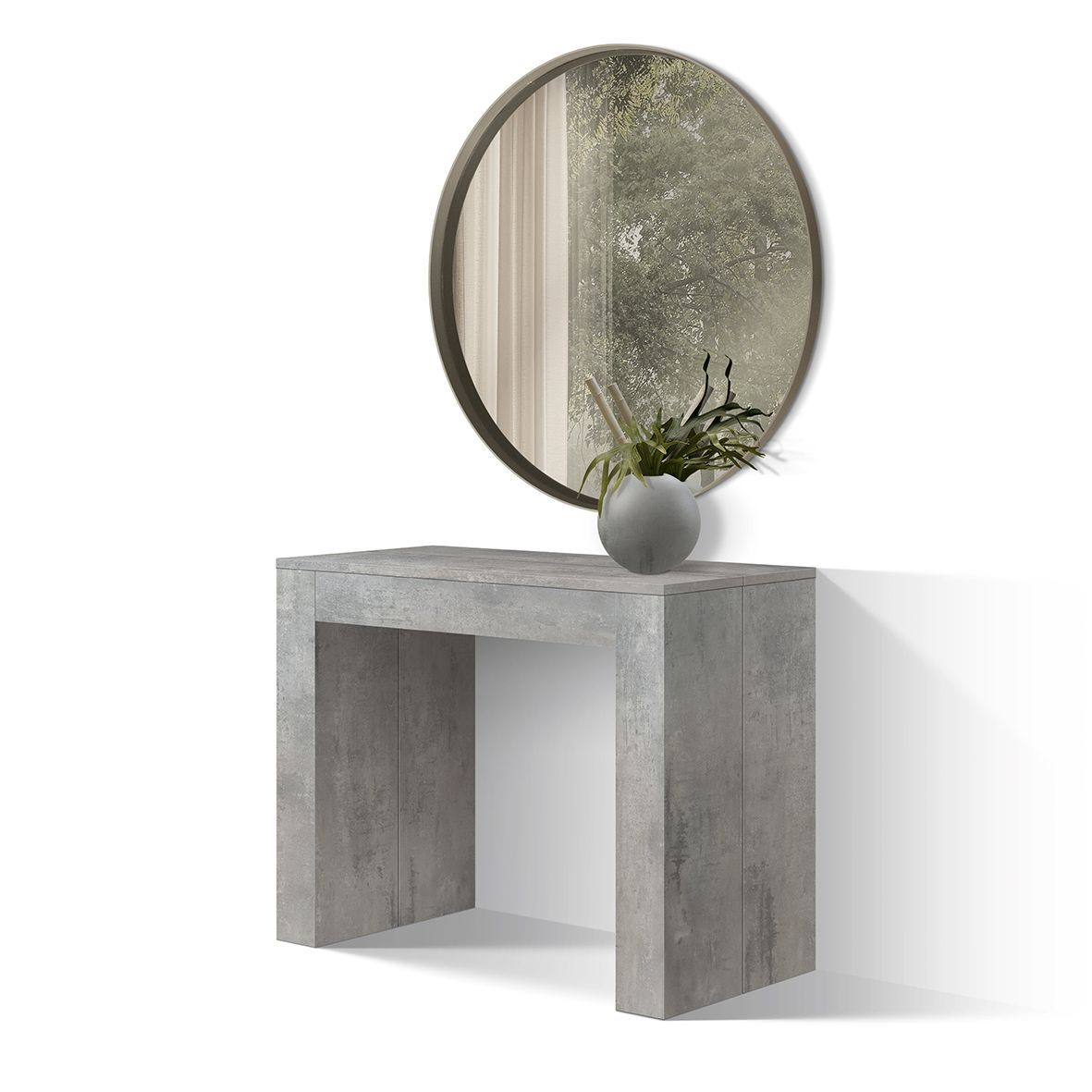 Consolle moderna con specchio rotondo, piccolo vaso e pianta in un ambiente minimalista sui toni del grigio.