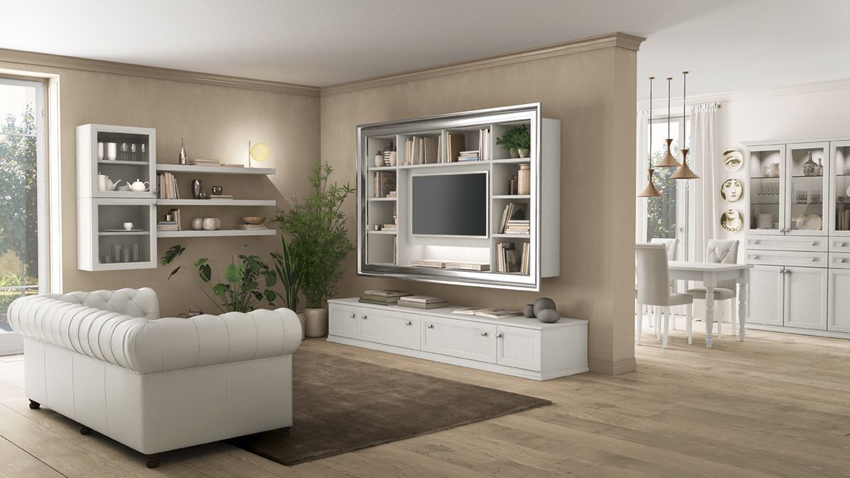 Luminoso soggiorno moderno con mobili bianchi, TV a parete, mensole e zona pranzo sullo sfondo.
