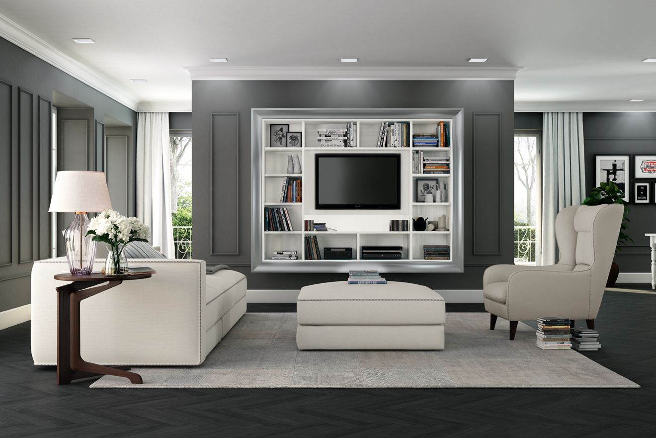 Soggiorno moderno grigio con divano angolare bianco, pouf e parete TV integrata con mensole.