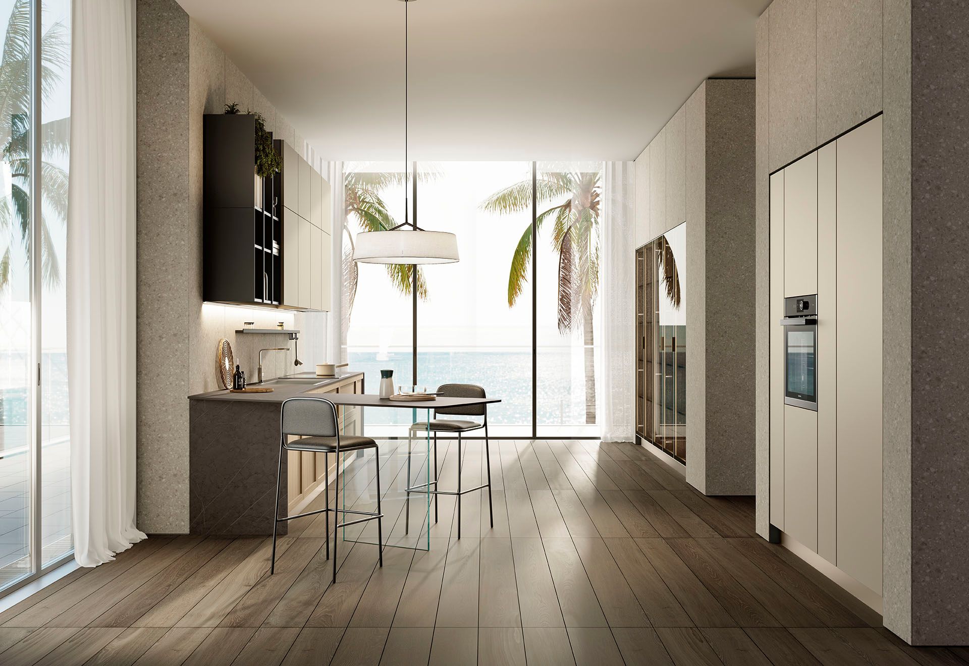 Cucina moderna a vista con zona pranzo, pavimenti in legno, mobili bianchi e vista sull'oceano attraverso porte finestre.