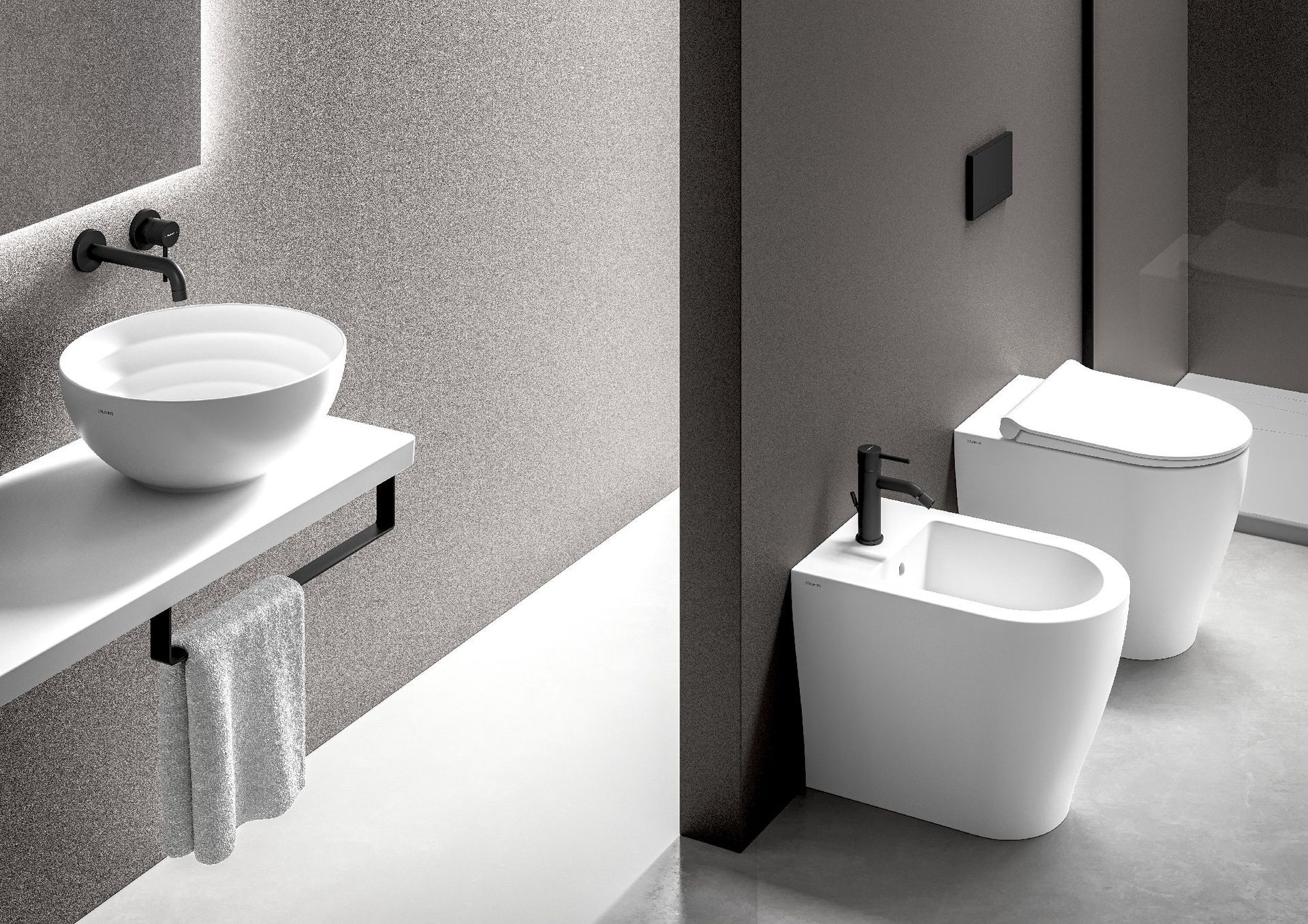 Bagno moderno con due lavandini bianchi, un WC e un orinatoio in un interno minimalista grigio.