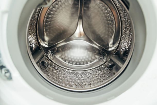 Inside of a front-loading washing machine drum, viewed from the opening