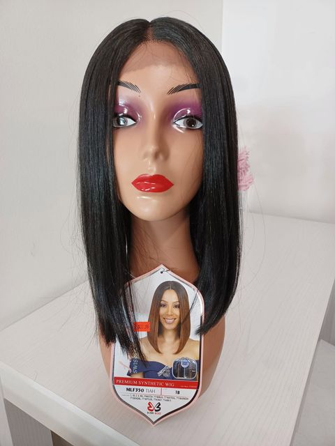 Mannequin head with long black hair, pink eye makeup, and red lipstick on a product display stand