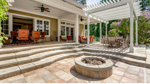 Patio with stone steps, fire pit, orange chairs, and pergola-covered dining area in a landscaped backyard