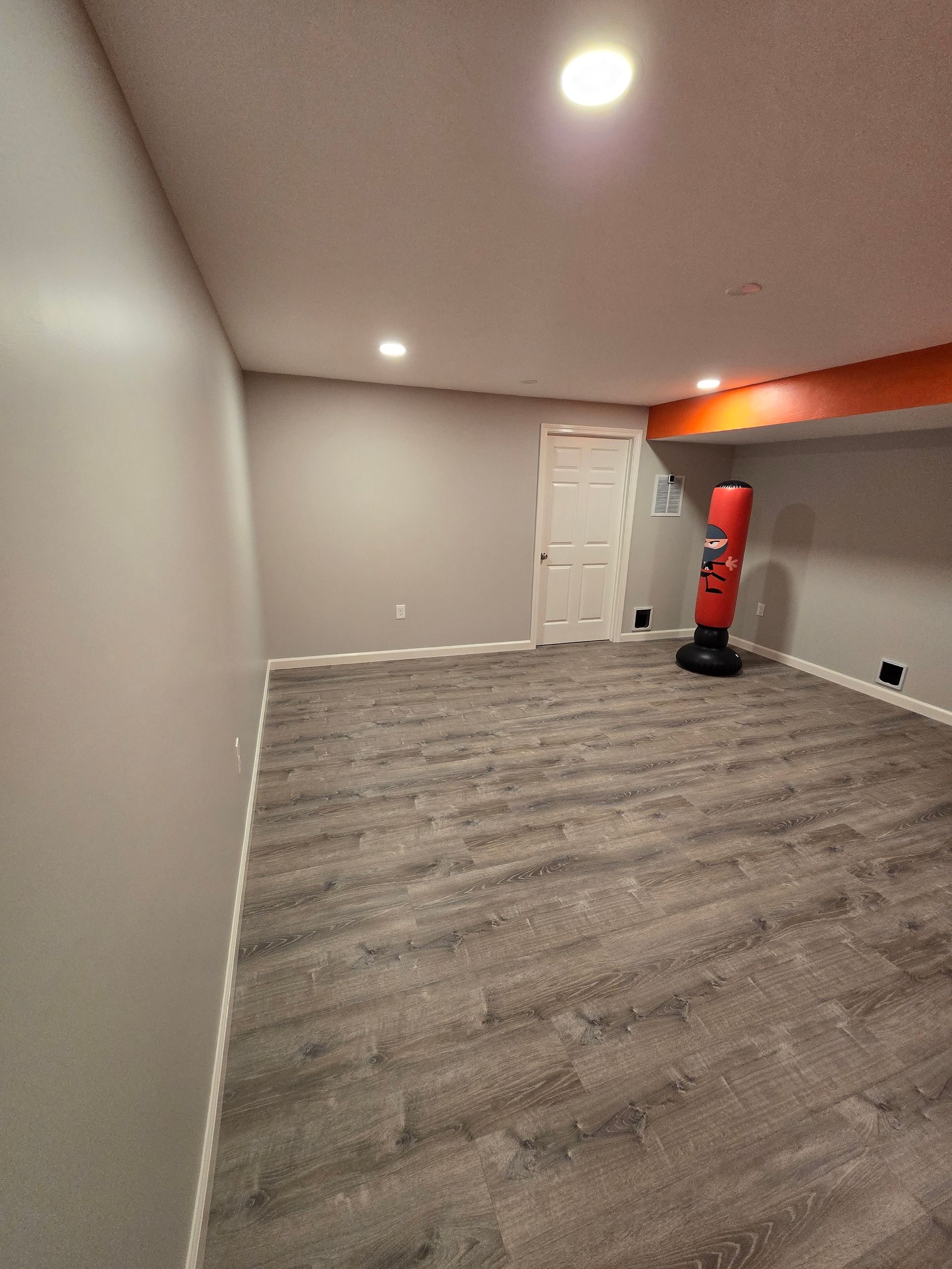 Basement Remodeling Project in Melrose, MA, by New England Painting and Contracting