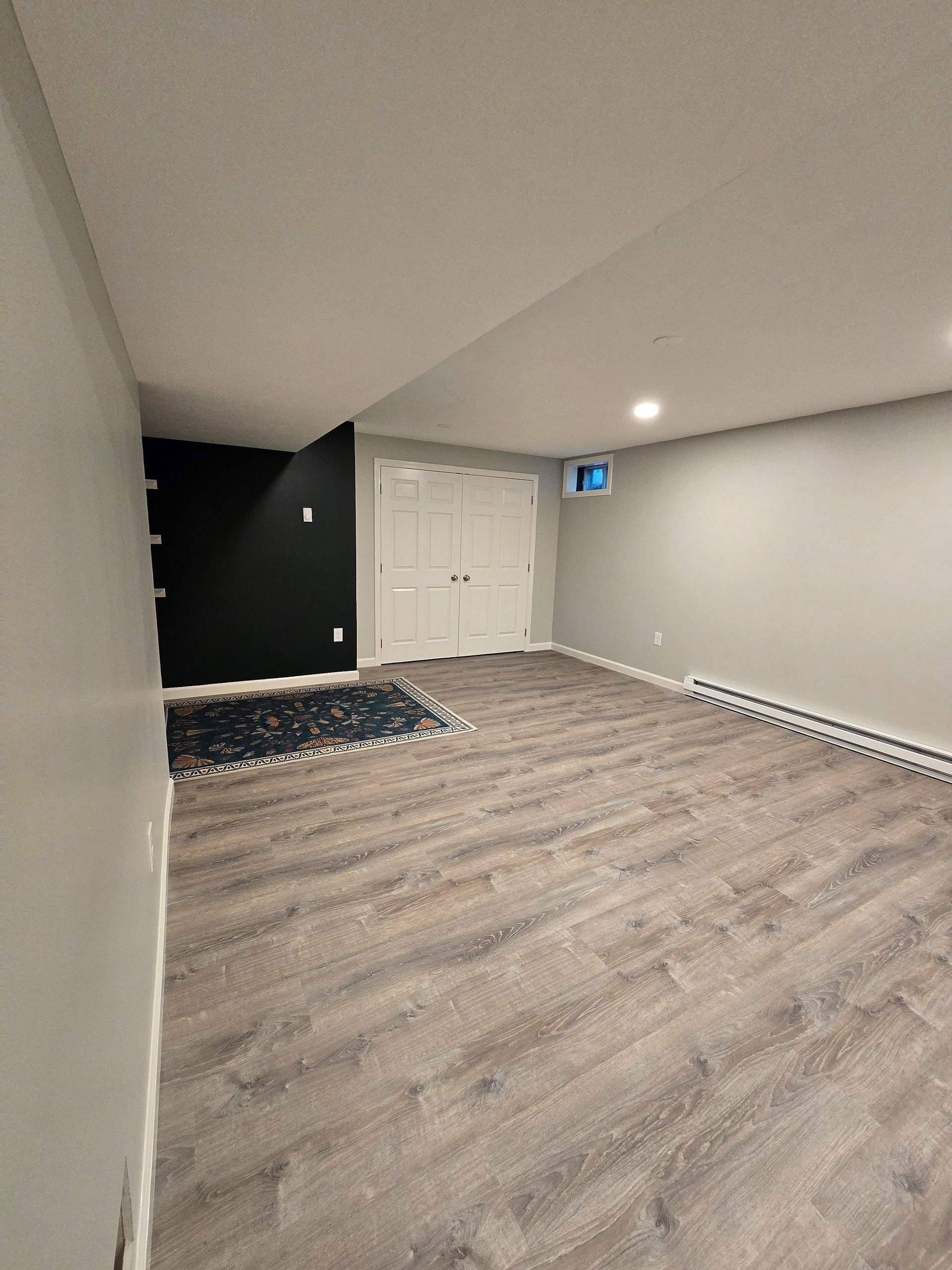 Basement Remodeling Project in Melrose, MA, by New England Painting and Contracting